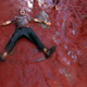 Image for article titled Photos: Spaniards mark another year by gleefully smashing each other in the face with tomatoes